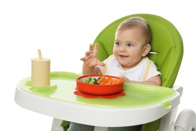 Photo of Cute little baby wearing bib while eating on white background