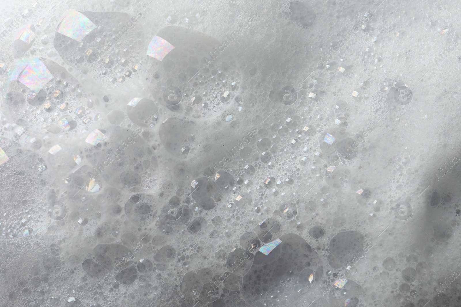 Photo of Fluffy soap foam as background, closeup view