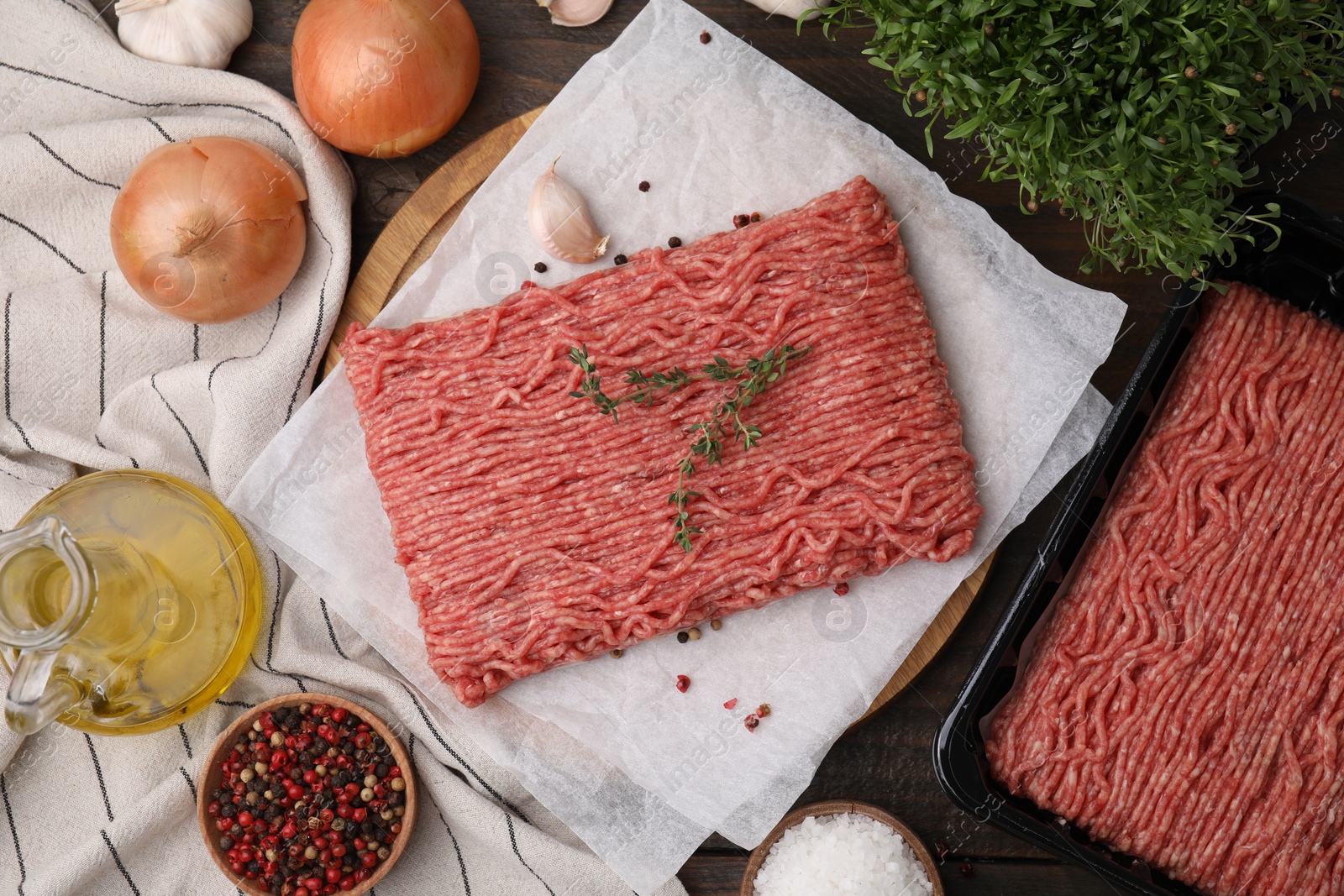 Photo of Flat lay composition with fresh raw ground meat on wooden table