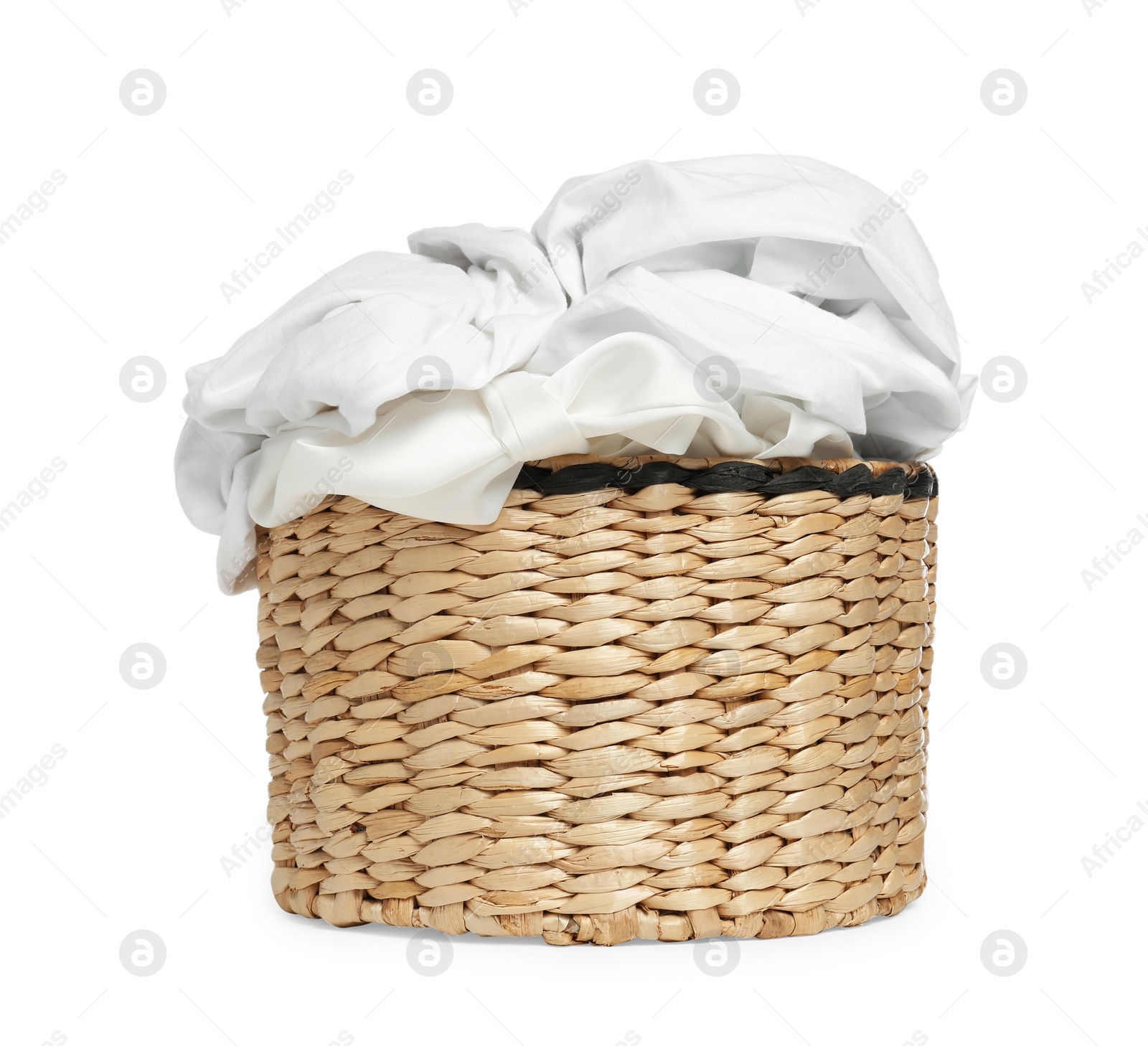 Photo of Wicker laundry basket with clean clothes isolated on white