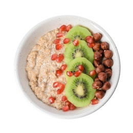 Photo of Bowl of quinoa porridge with hazelnuts, kiwi and pomegranate seeds on white background, top view