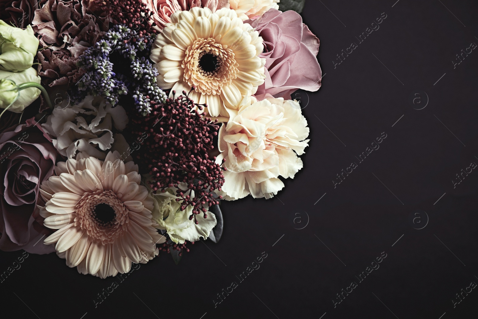 Photo of Beautiful bouquet on black background. Floral card design with dark vintage effect