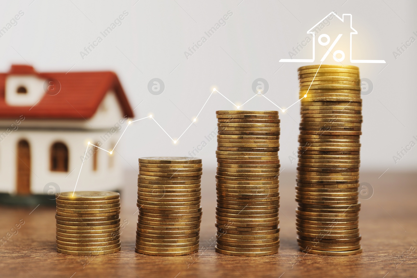 Image of Mortgage rate. Stacked coins, graph and model of house