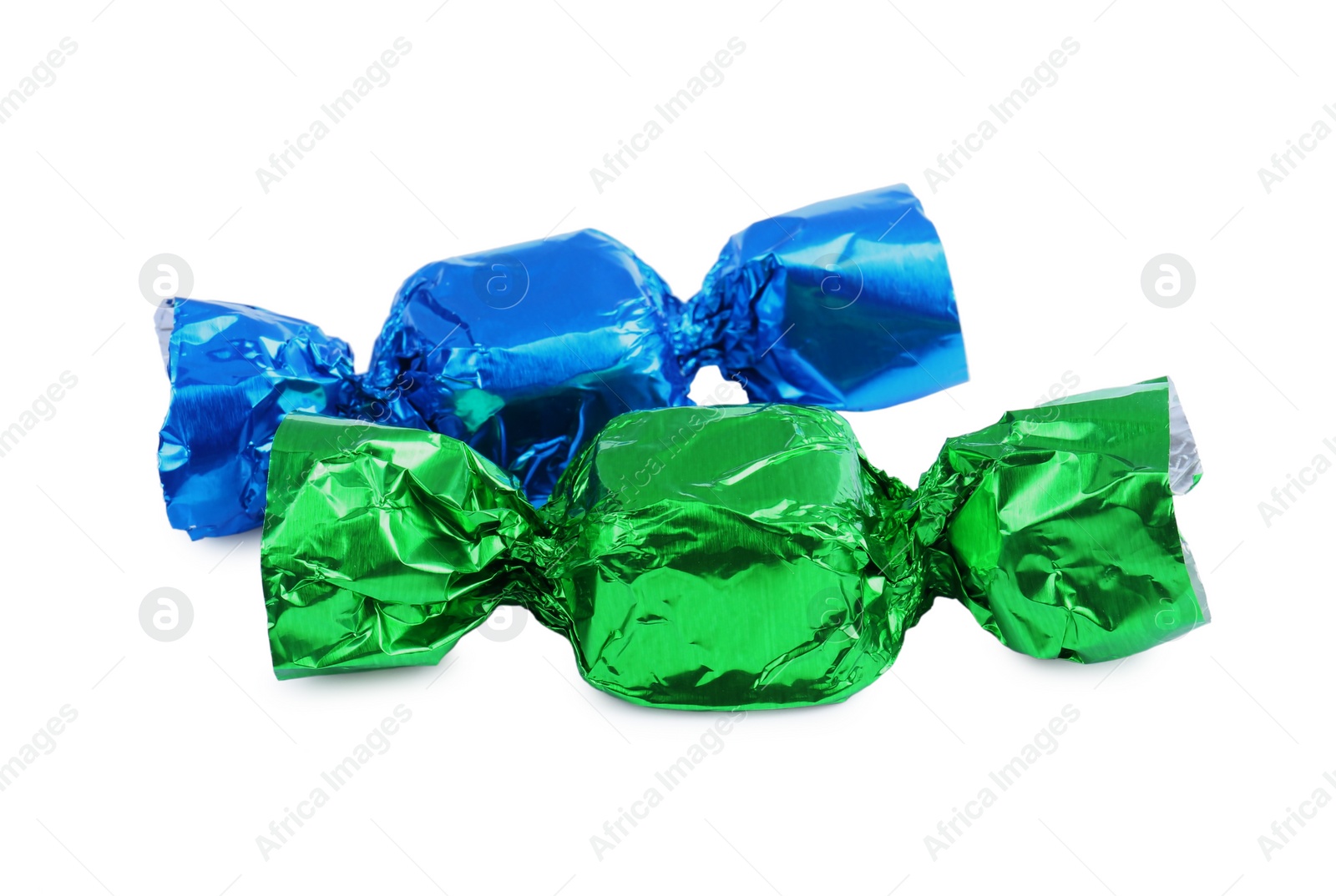 Photo of Tasty candies in colorful wrappers isolated on white