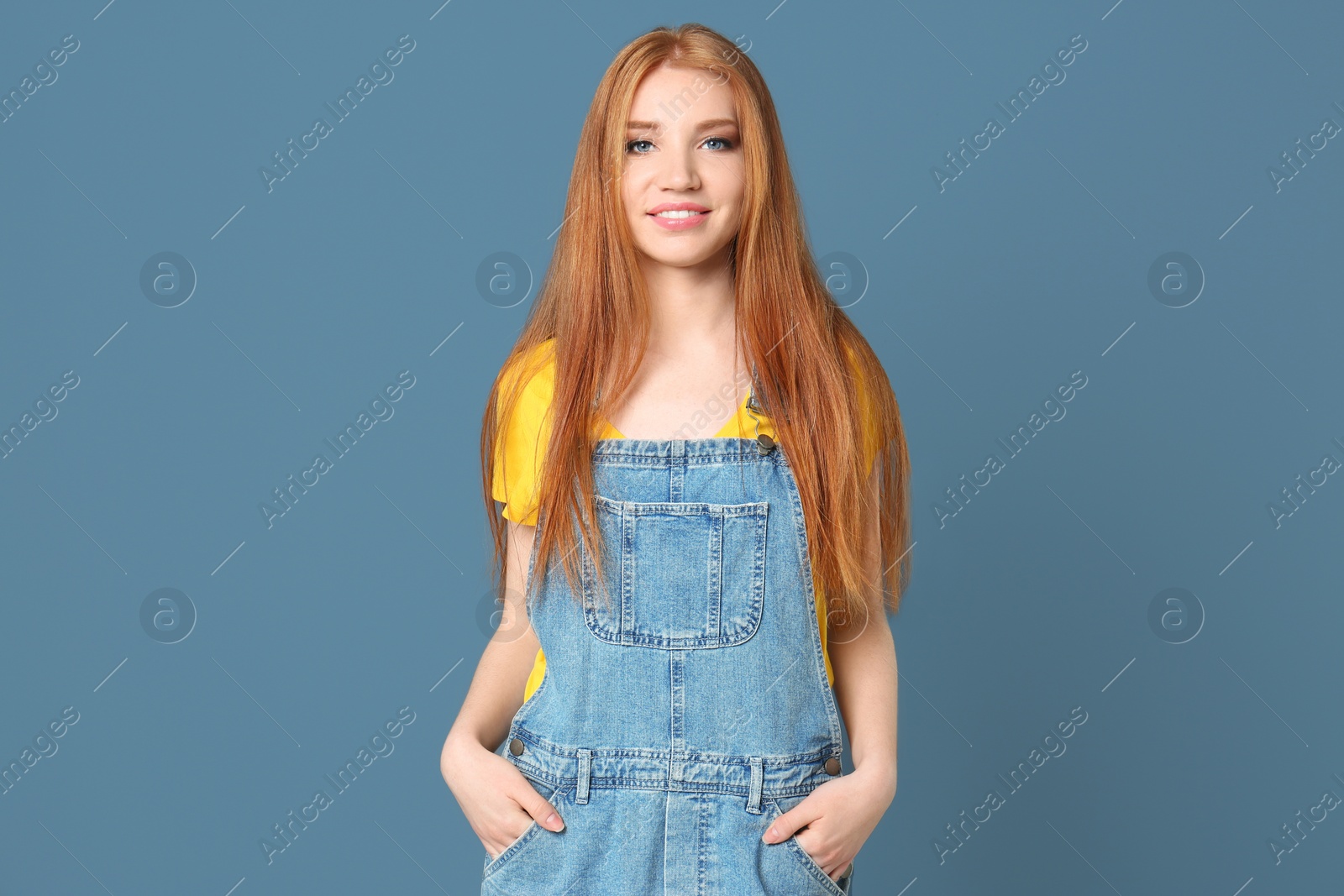 Photo of Portrait of young model with beautiful  hair on color background