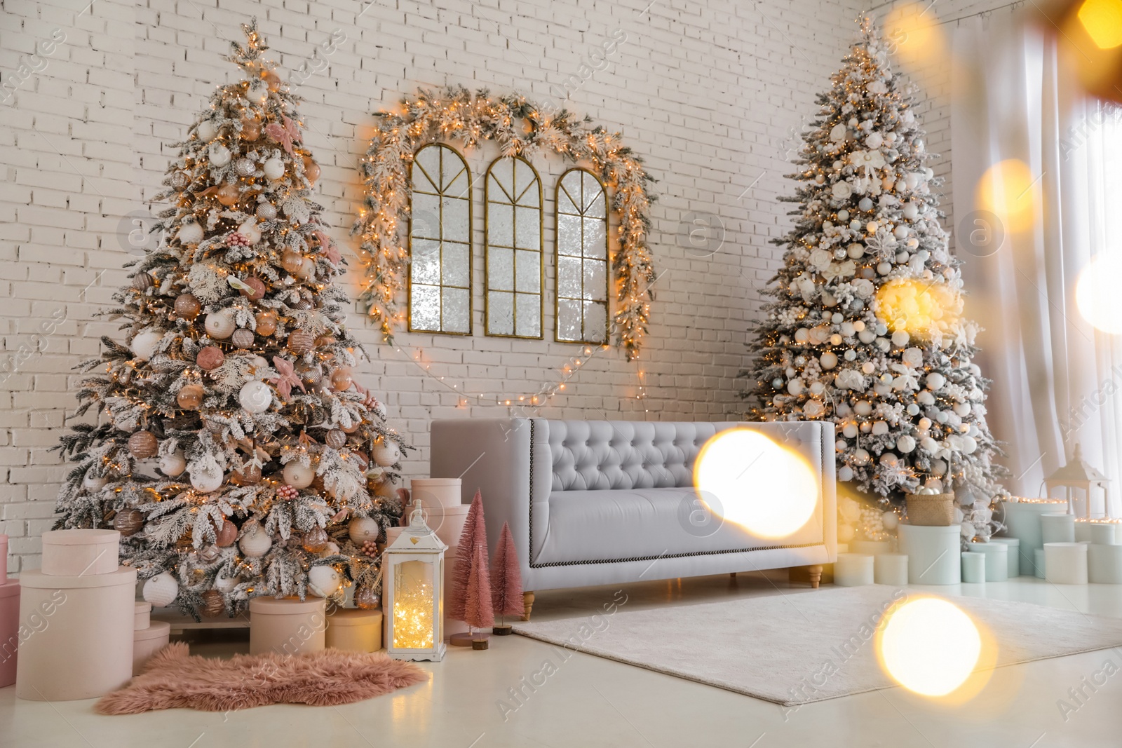 Photo of Beautiful interior of living room with decorated Christmas trees