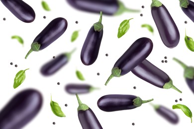 Image of Fresh whole eggplants, basil and peppercorns falling on white background