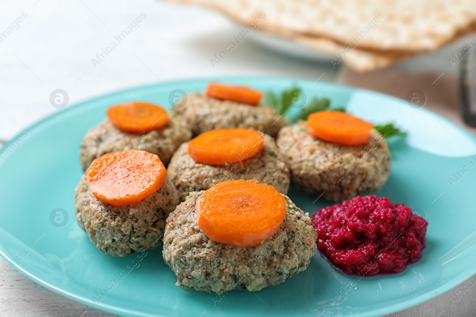 Photo of Plate of traditional Passover (Pesach) gefilte fish on table, closeup