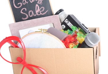 Box of unwanted stuff isolated on white. Garage sale