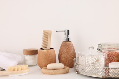 Photo of Different bath accessories and personal care products on white table