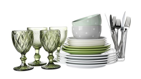 Set of beautiful ceramic dishware, glasses and cutlery isolated on white