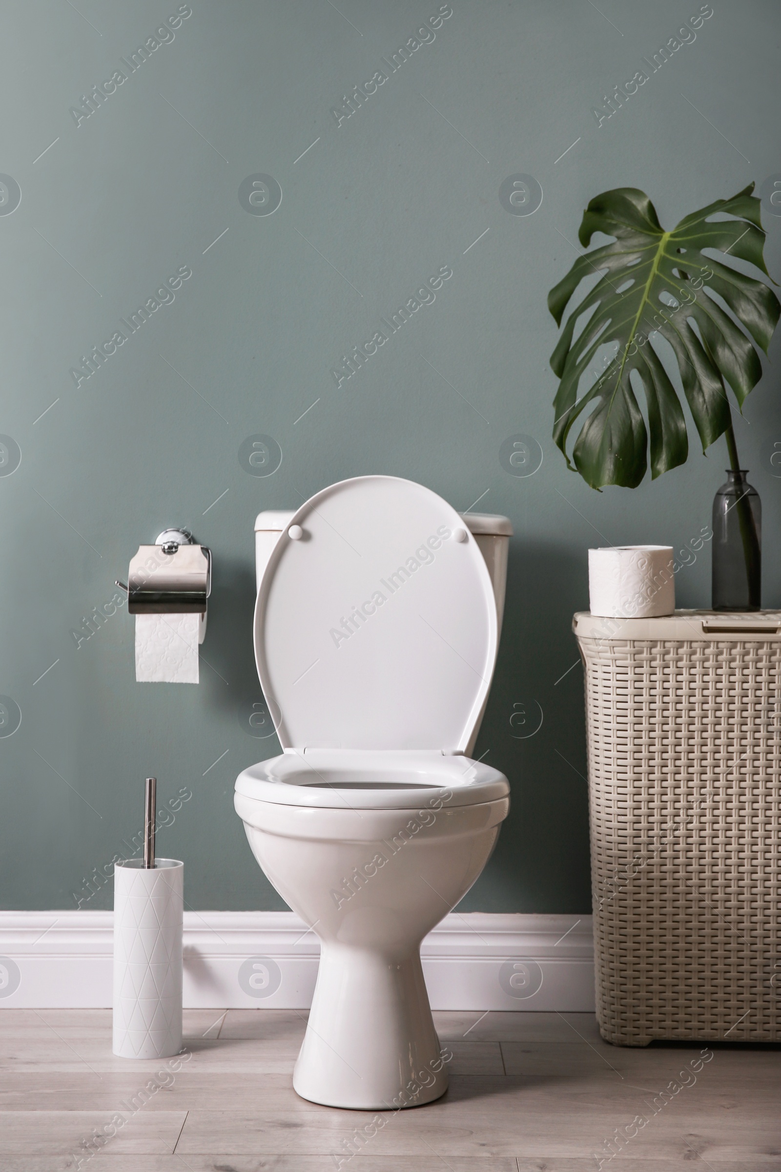 Photo of New ceramic toilet bowl in modern bathroom