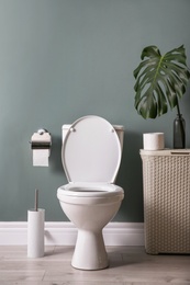 New ceramic toilet bowl in modern bathroom