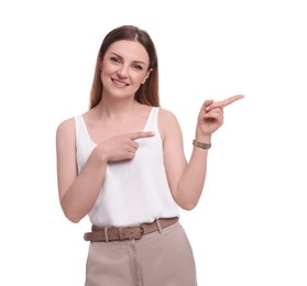 Photo of Beautiful businesswoman pointing at something against white background