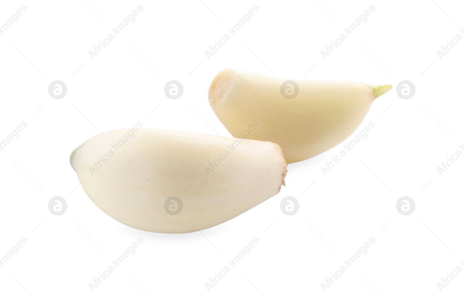 Photo of Peeled cloves of garlic isolated on white