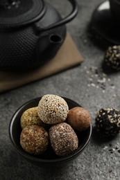 Photo of Delicious vegan candy balls on grey table