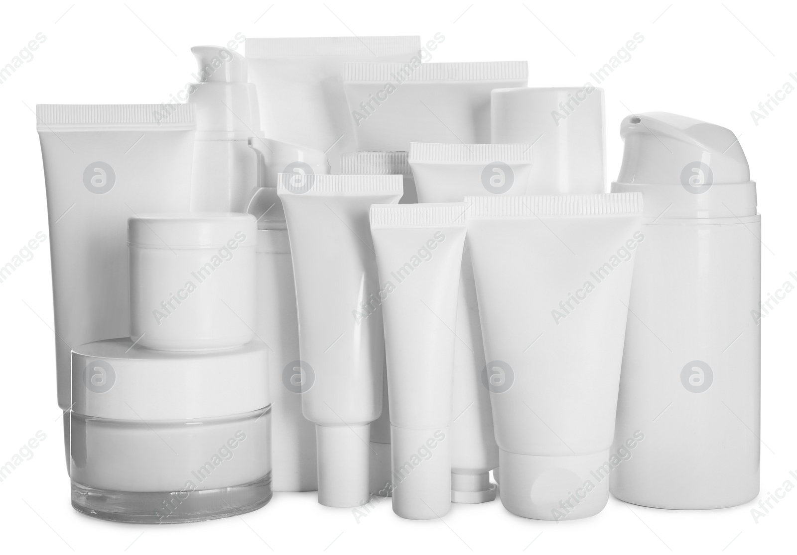 Photo of Blank tubes and jars of cosmetic products on white background