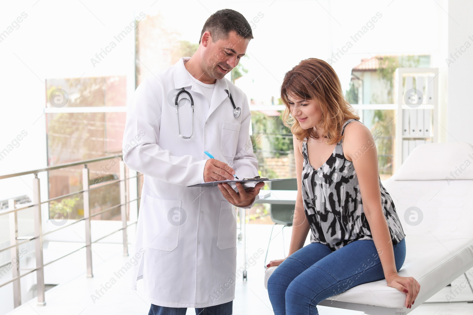 Photo of Patient having appointment with doctor in hospital