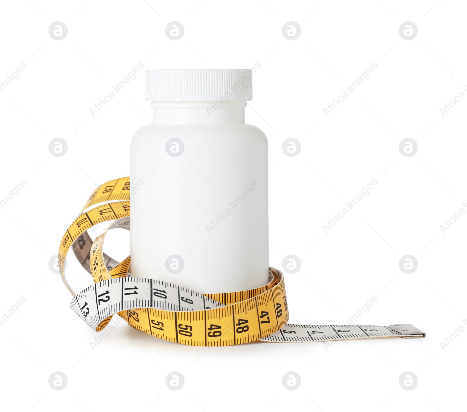 Photo of Bottle with weight loss pills and measuring tape on white background