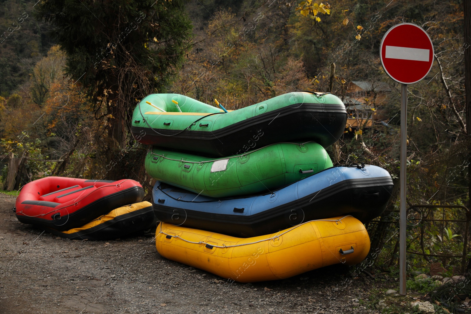 Photo of Inflatable rubber fishing boats and trees outdoors