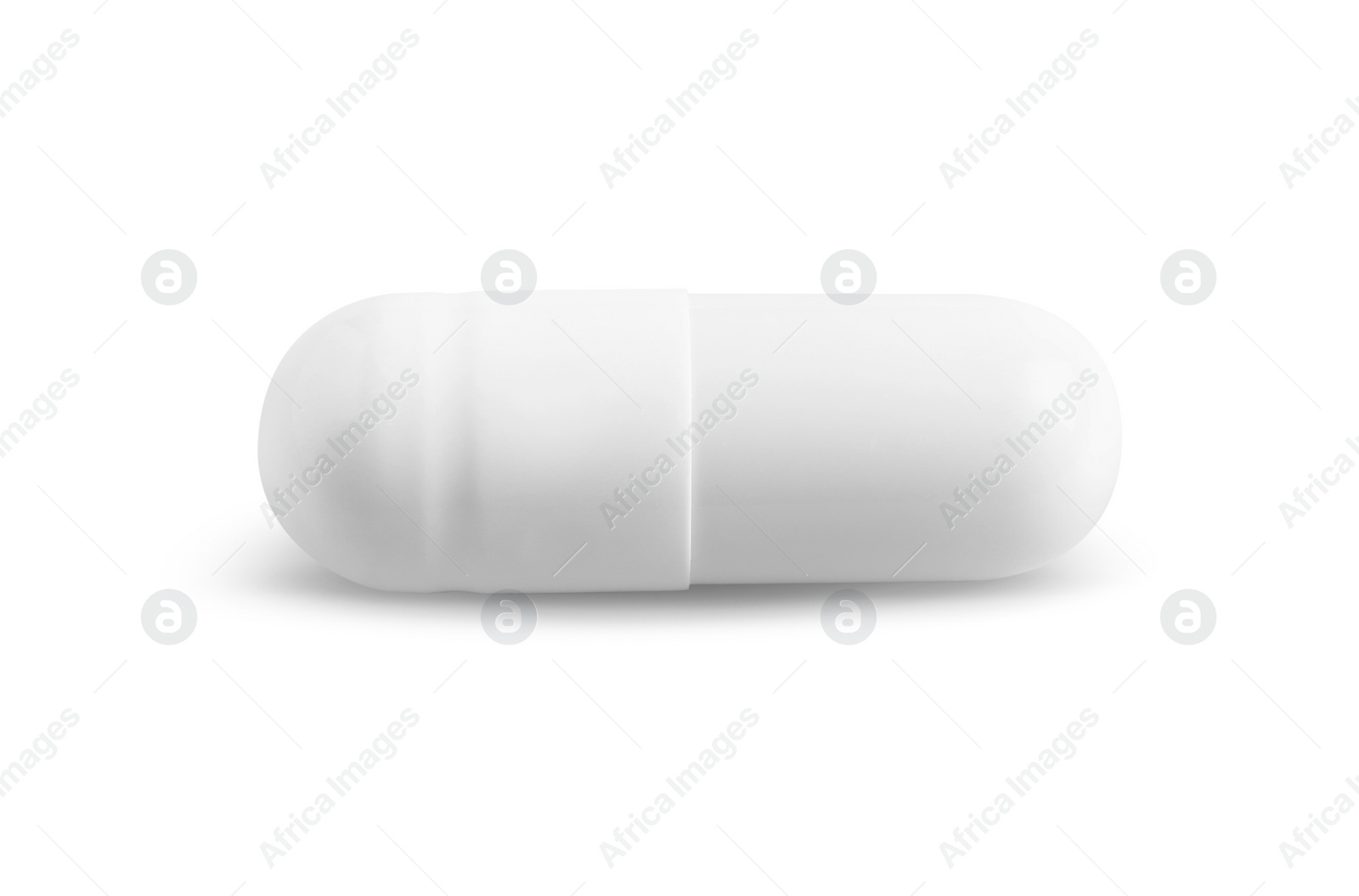 Photo of One pill on white background. Medicinal treatment