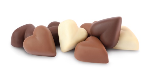 Delicious heart shaped chocolate candies on white background