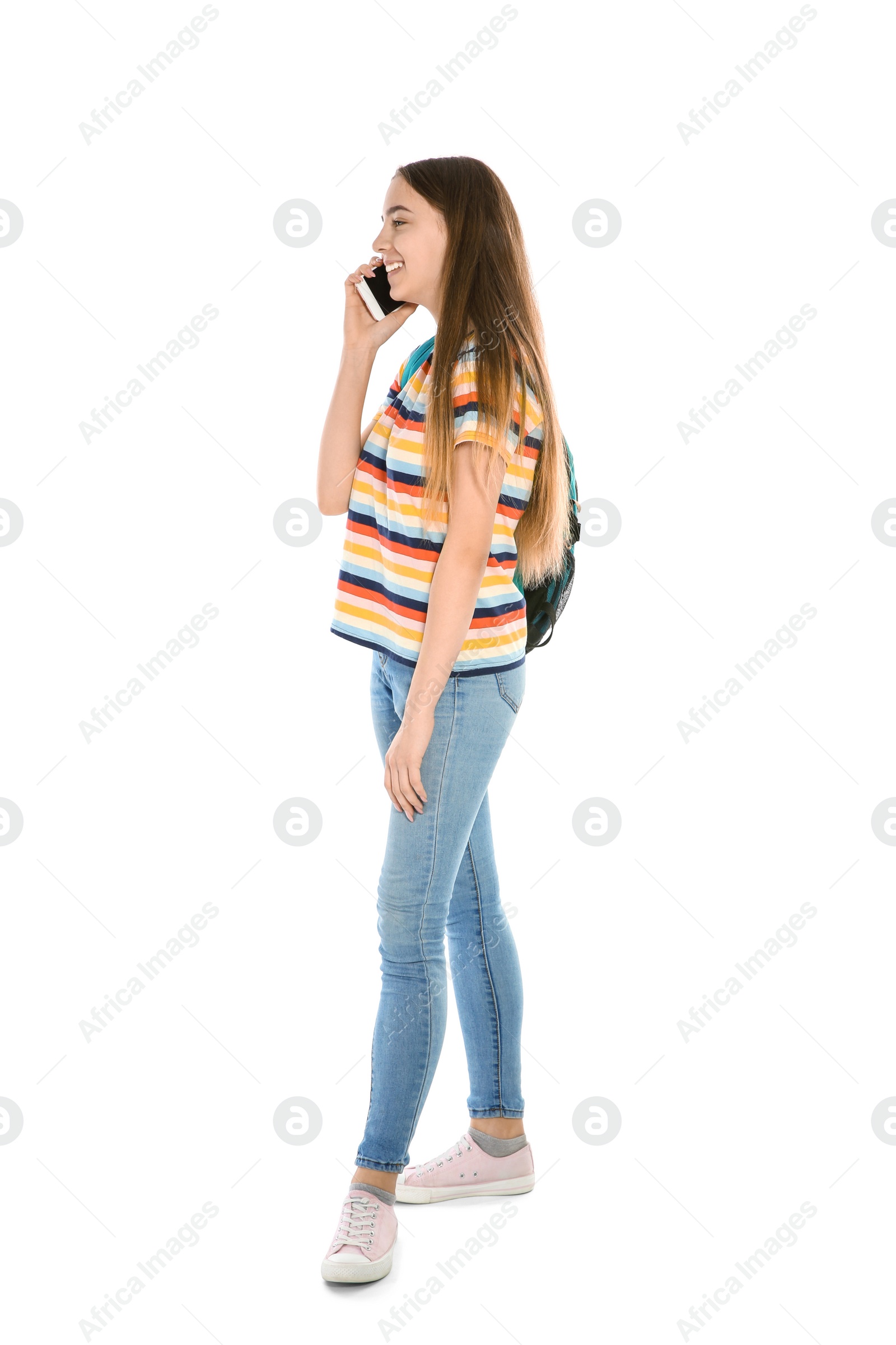 Photo of Beautiful teenager girl with mobile phone on white background