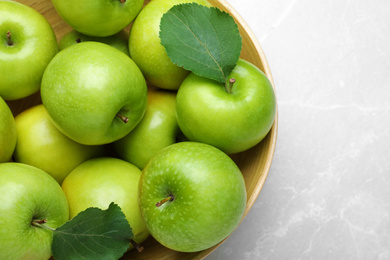 Photo of Ripe juicy green apples on white table, top view