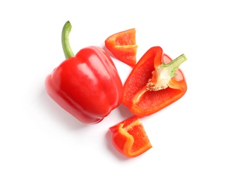 Photo of Cut and whole ripe red bell peppers on white background, top view