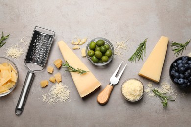 Flat lay composition with parmesan cheese on grey table