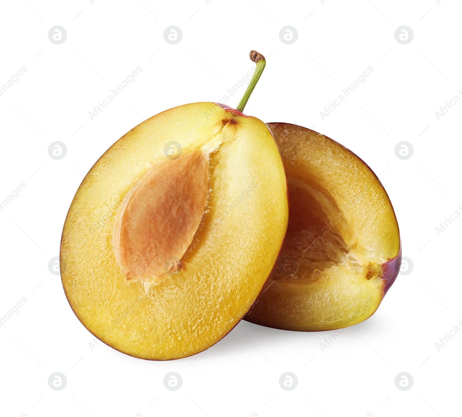 Photo of Halves of fresh ripe plum on white background