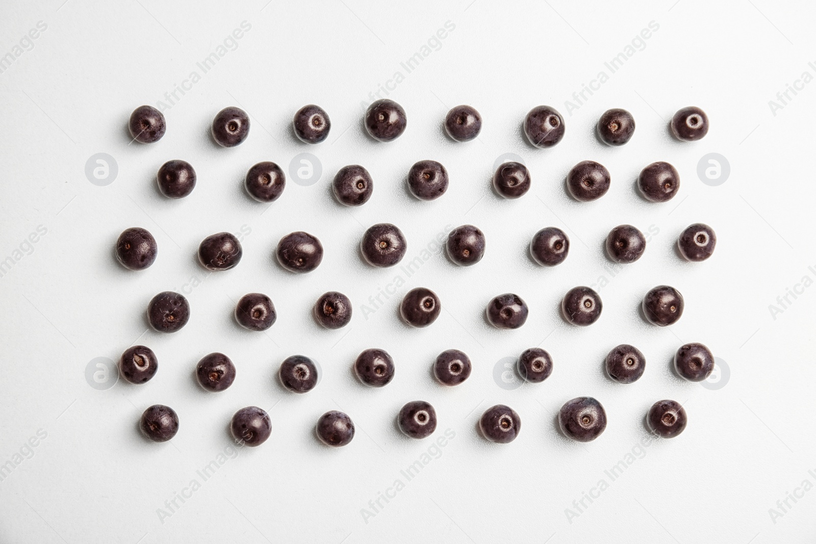 Photo of Fresh acai berries on white background