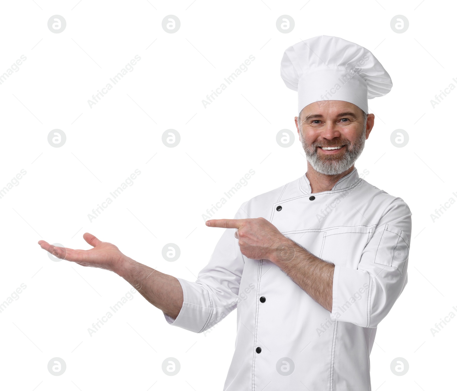 Photo of Happy chef in uniform pointing at something on white background