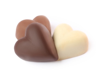 Delicious heart shaped chocolate candies on white background