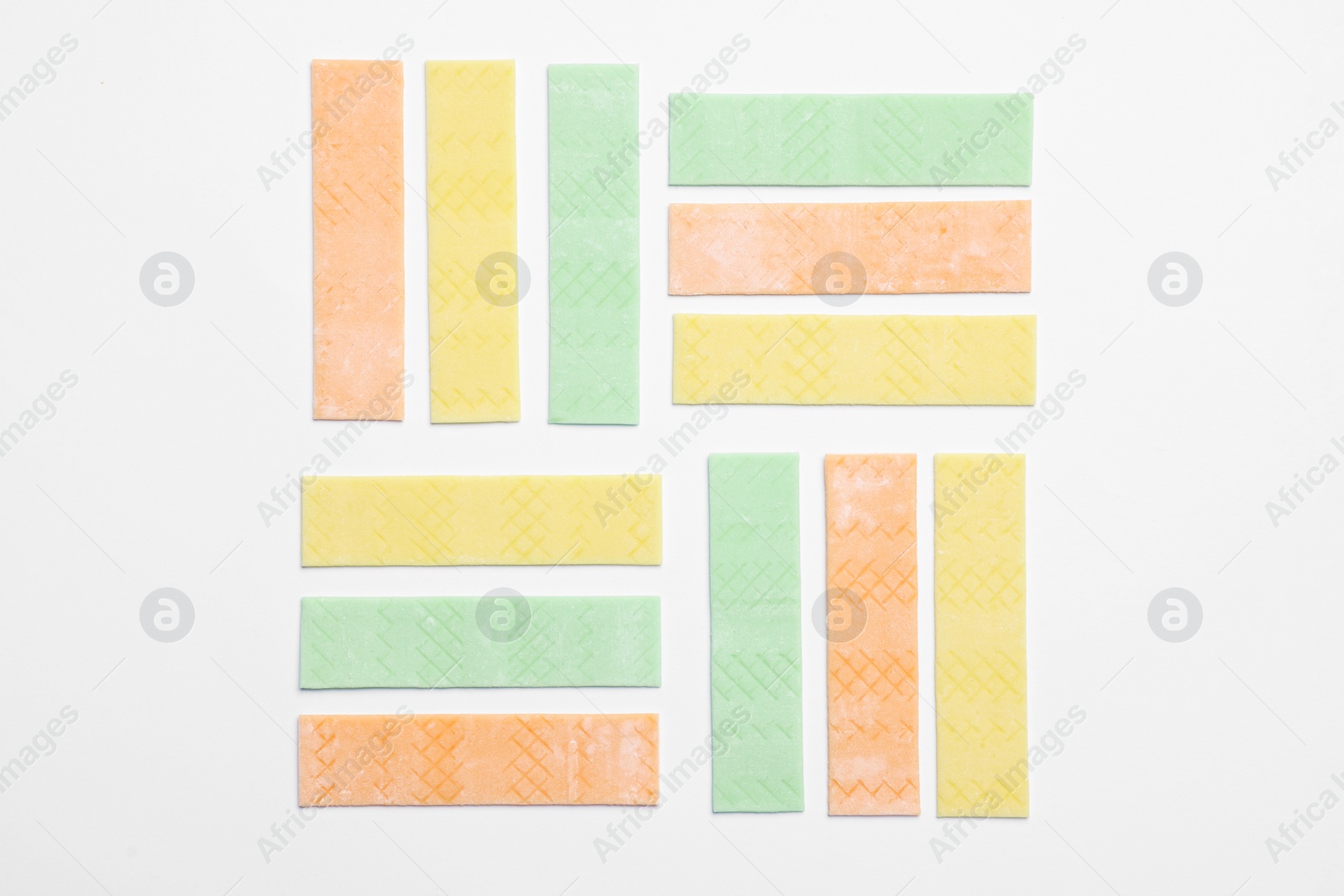 Photo of Sticks of tasty bubble gums on white background, flat lay