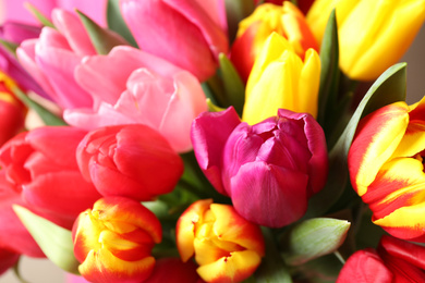 Photo of Beautiful spring tulips as background, closeup view