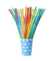 Color plastic cocktail tubes in paper cup on white background