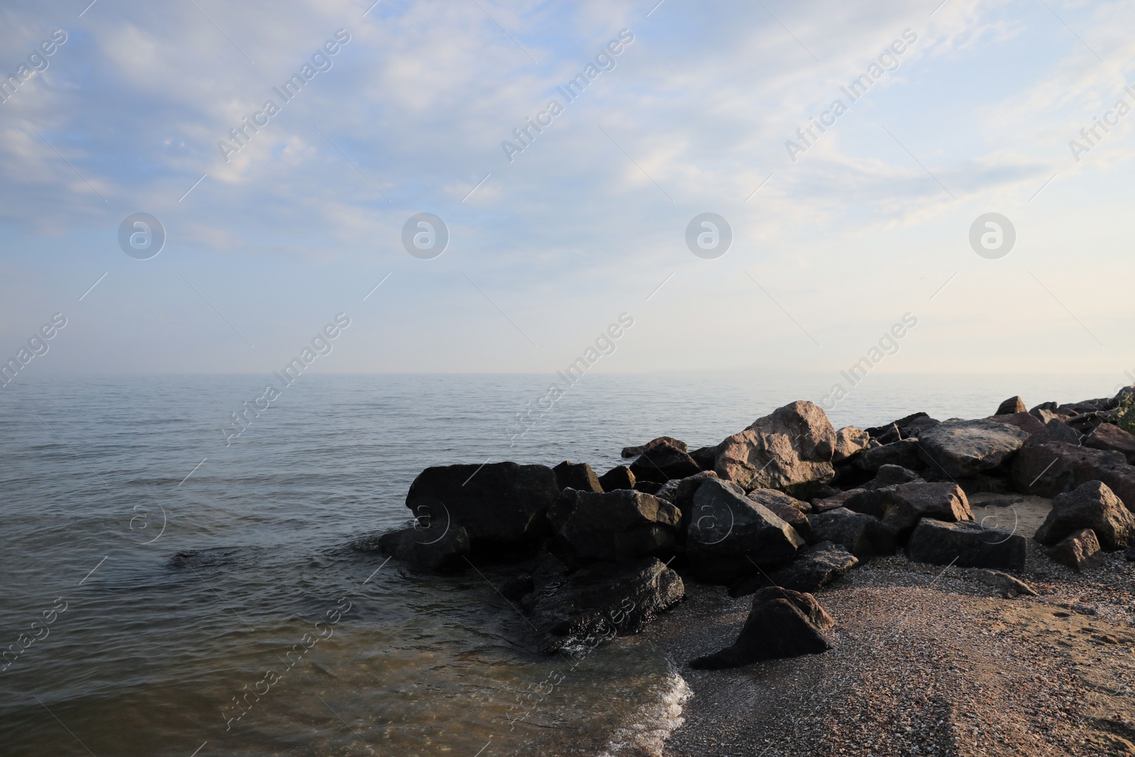 Photo of Beautiful view sandy sea beach with rocks