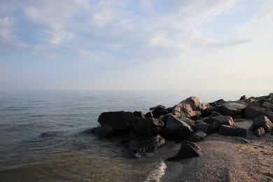 Beautiful view sandy sea beach with rocks