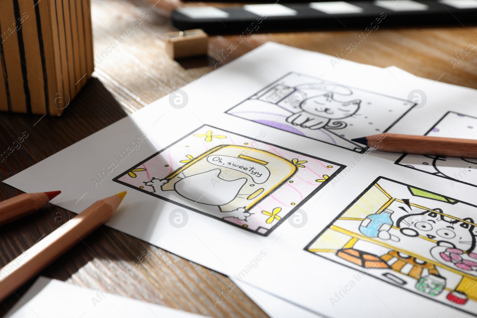 Photo of Storyboard with cartoon sketches at workplace. Pre-production process