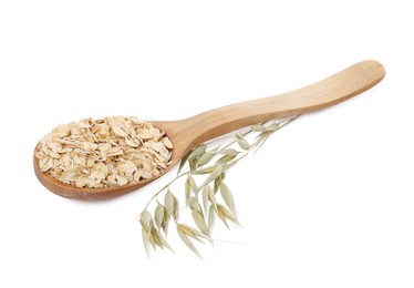 Photo of Wooden spoon of oatmeal and branch with florets isolated on white