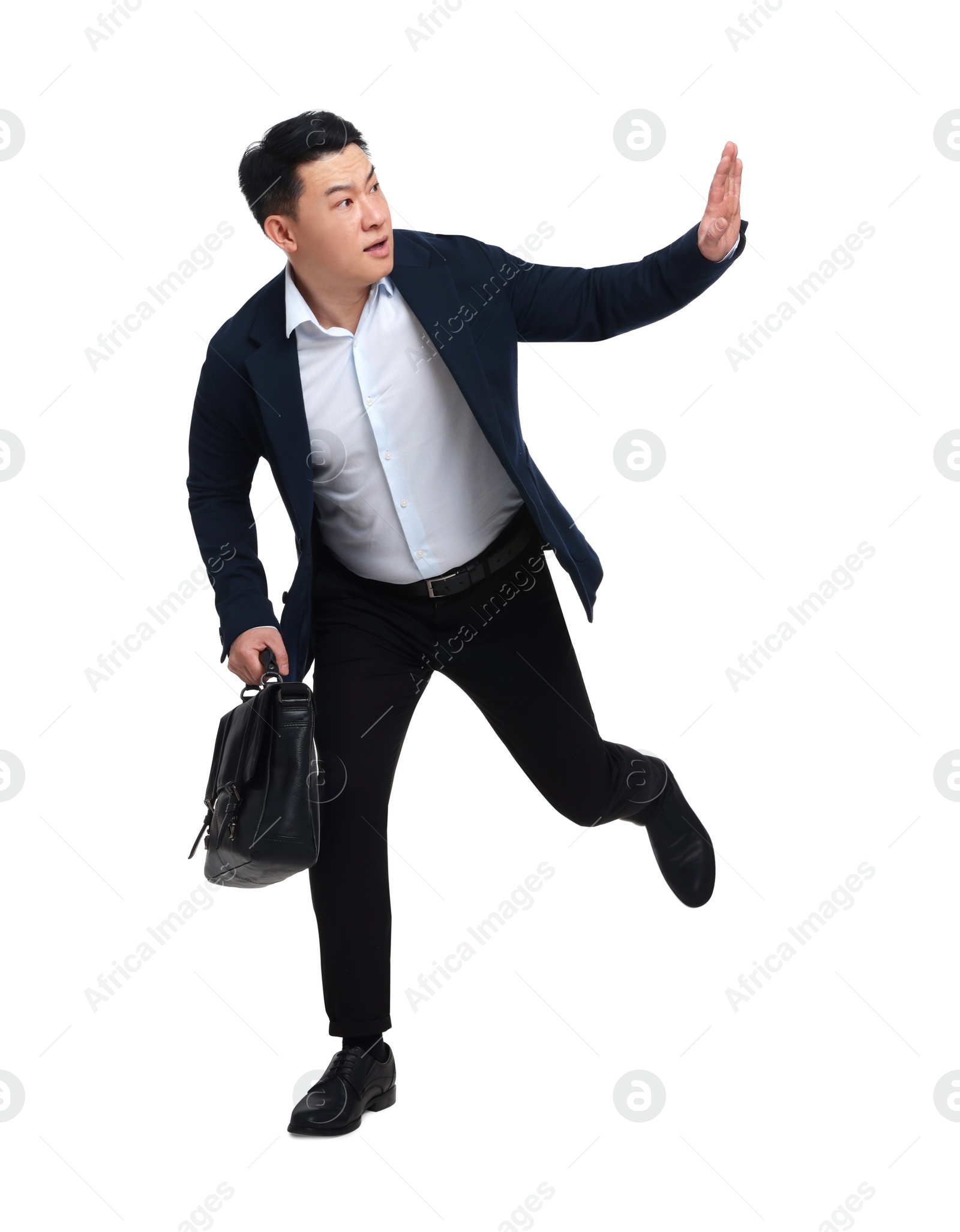 Photo of Businessman in suit with briefcase running on white background