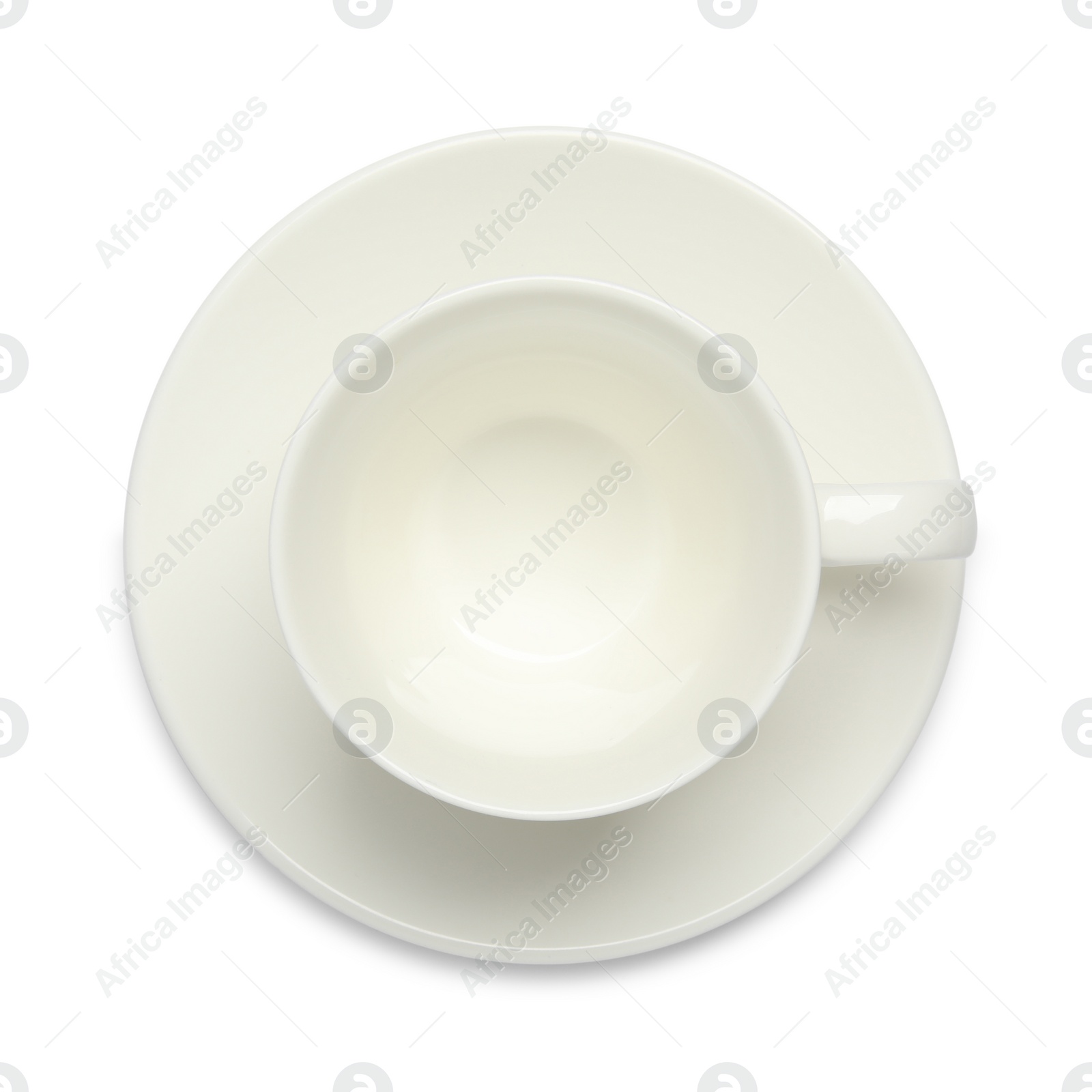 Photo of Empty ceramic cup and saucer isolated on white, top view