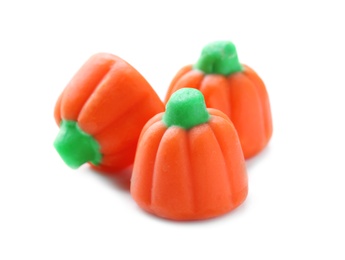Photo of Tasty colorful candies for Halloween party on white background, closeup