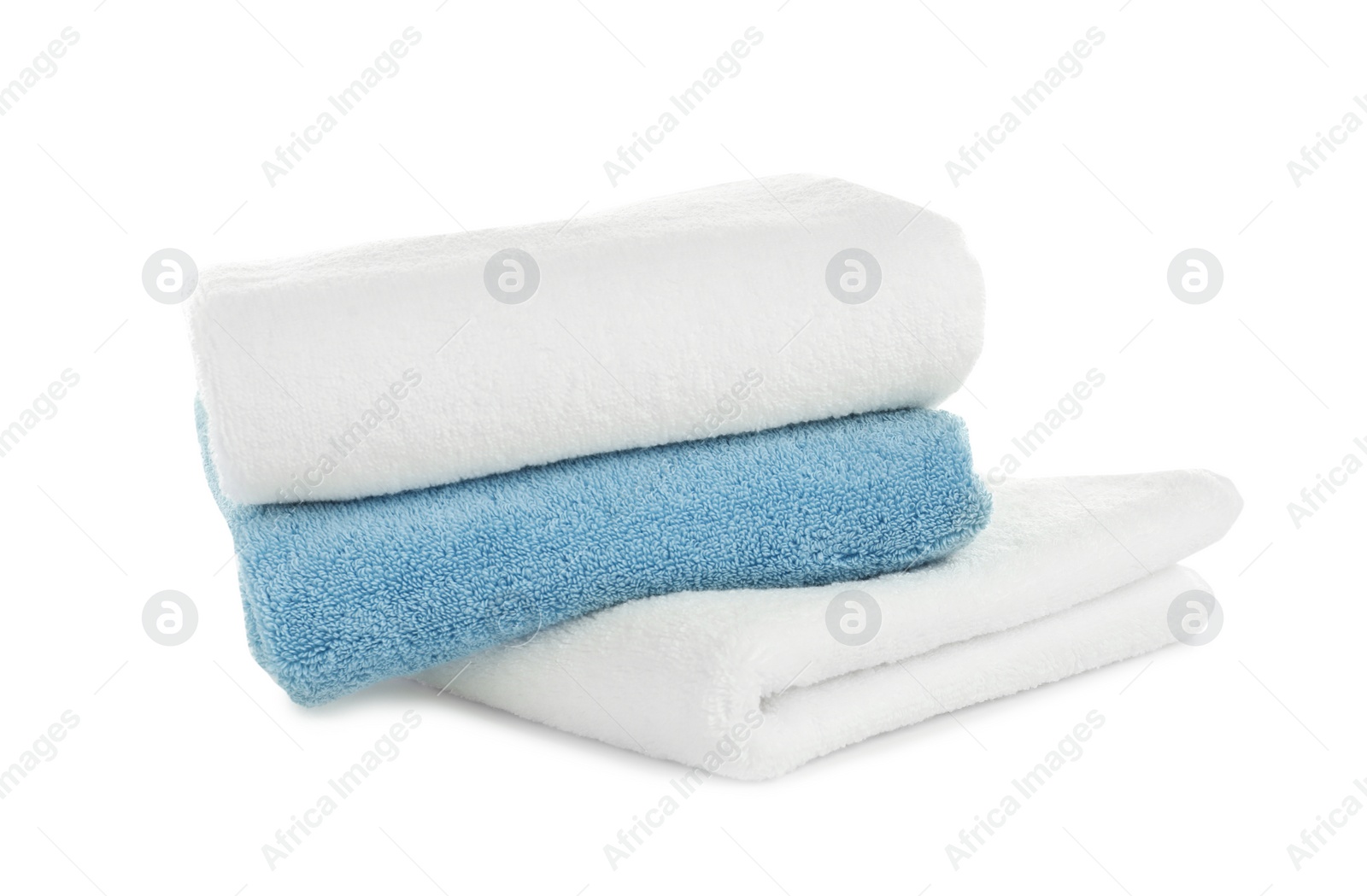 Photo of Folded clean soft towels on white background