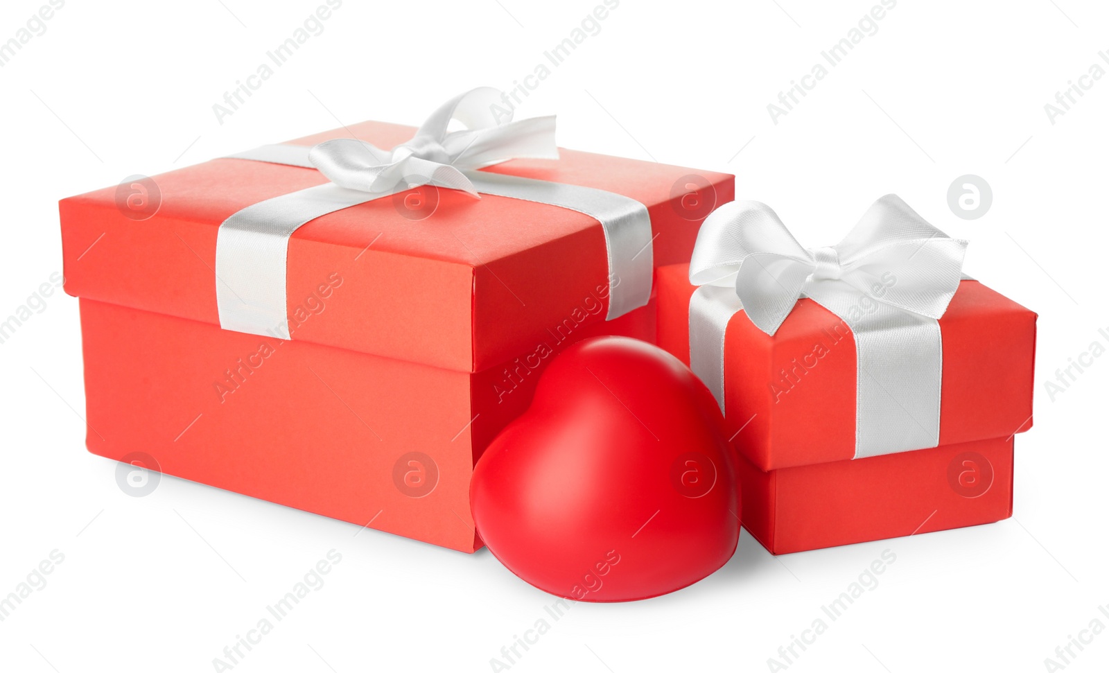 Photo of Beautiful gift boxes and red heart on white background. Valentine's day celebration