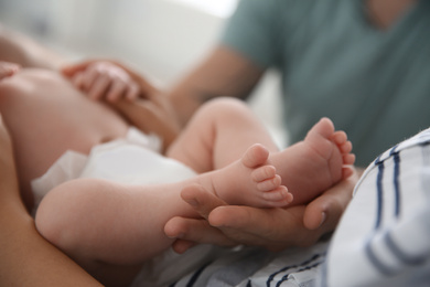 Couple with their newborn baby, closeup view