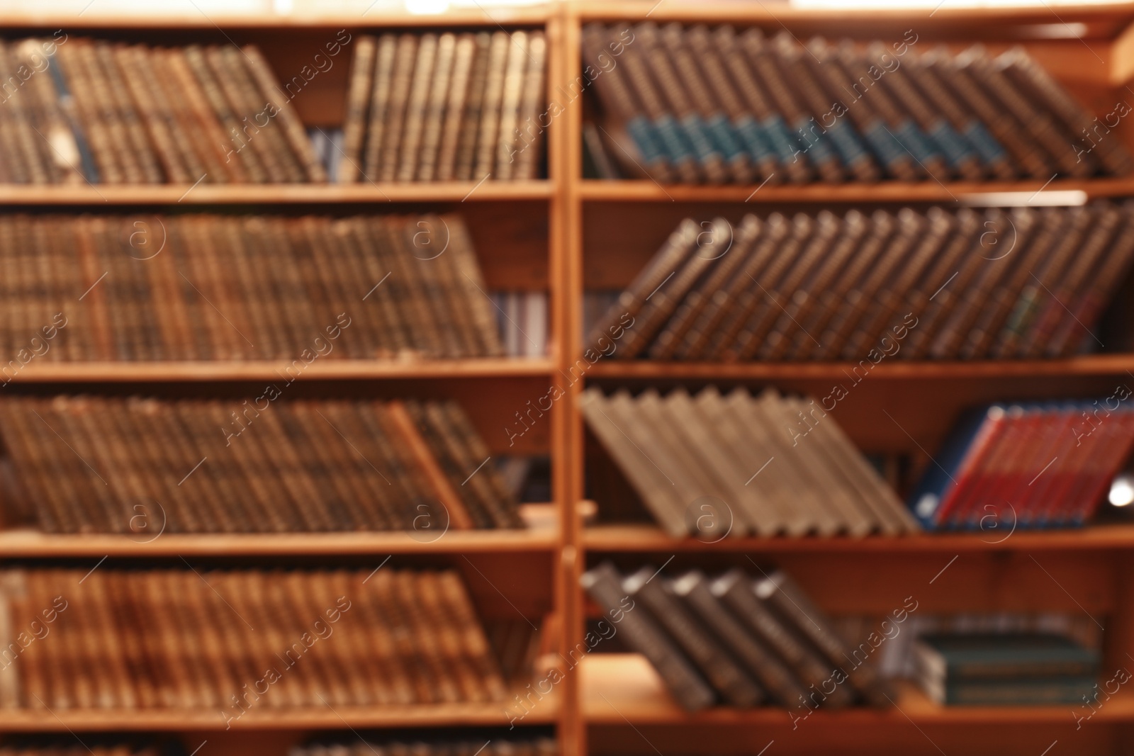 Photo of Blurred view of books on shelves in library