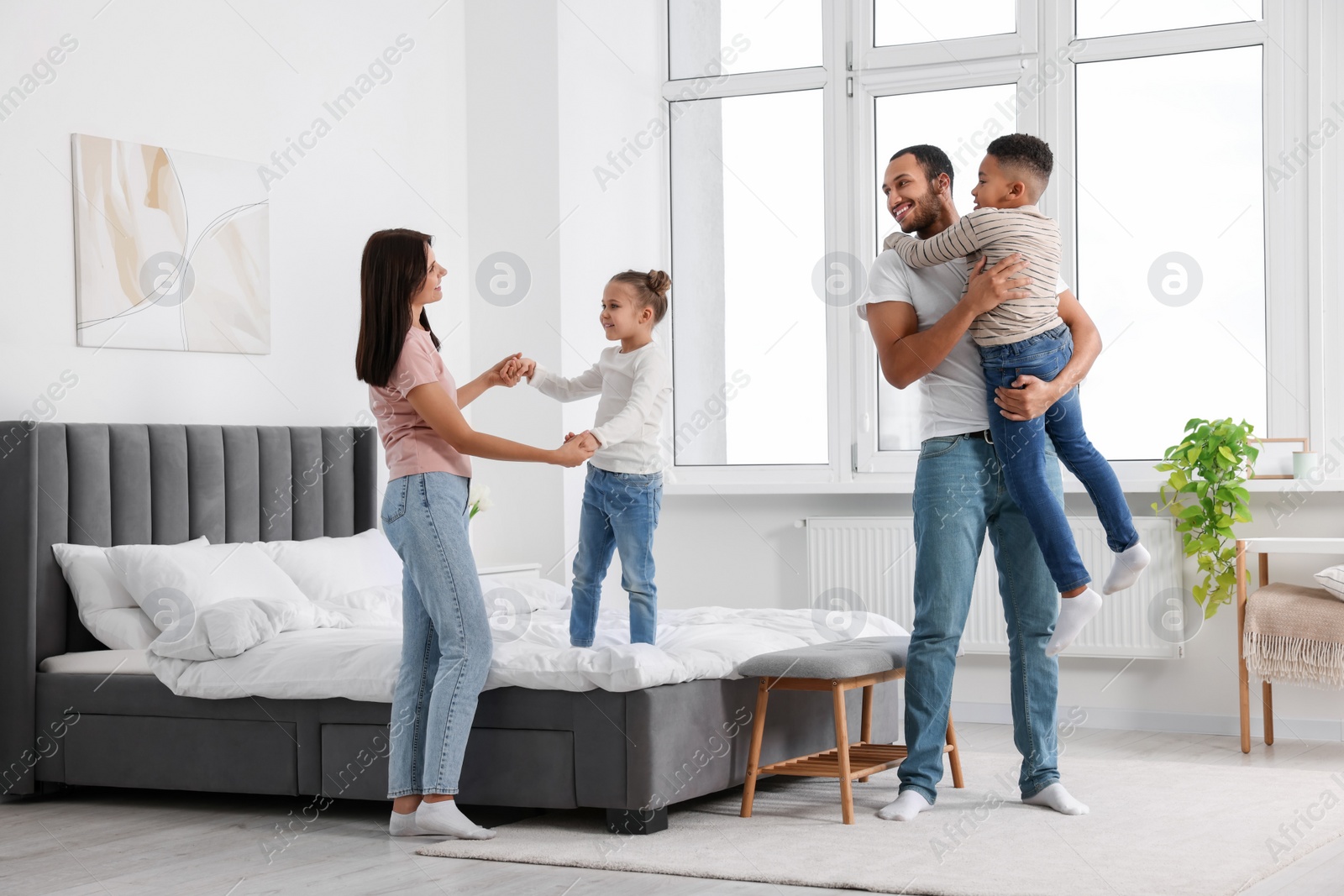 Photo of Happy international family spending time together at home