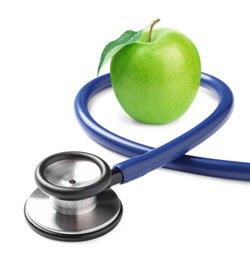 Image of Stethoscope and green apple on white background 